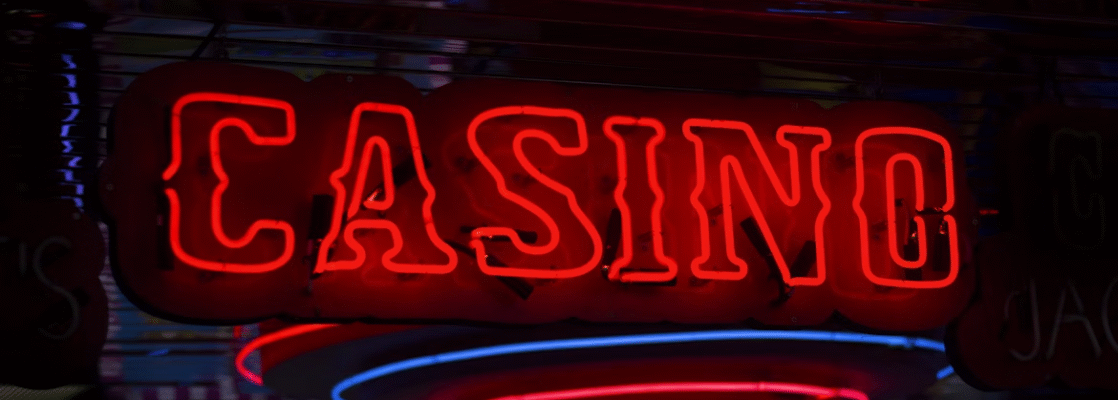 Red casino text on black background.