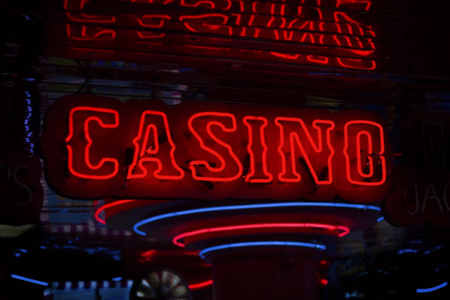 Red casino text on black background.